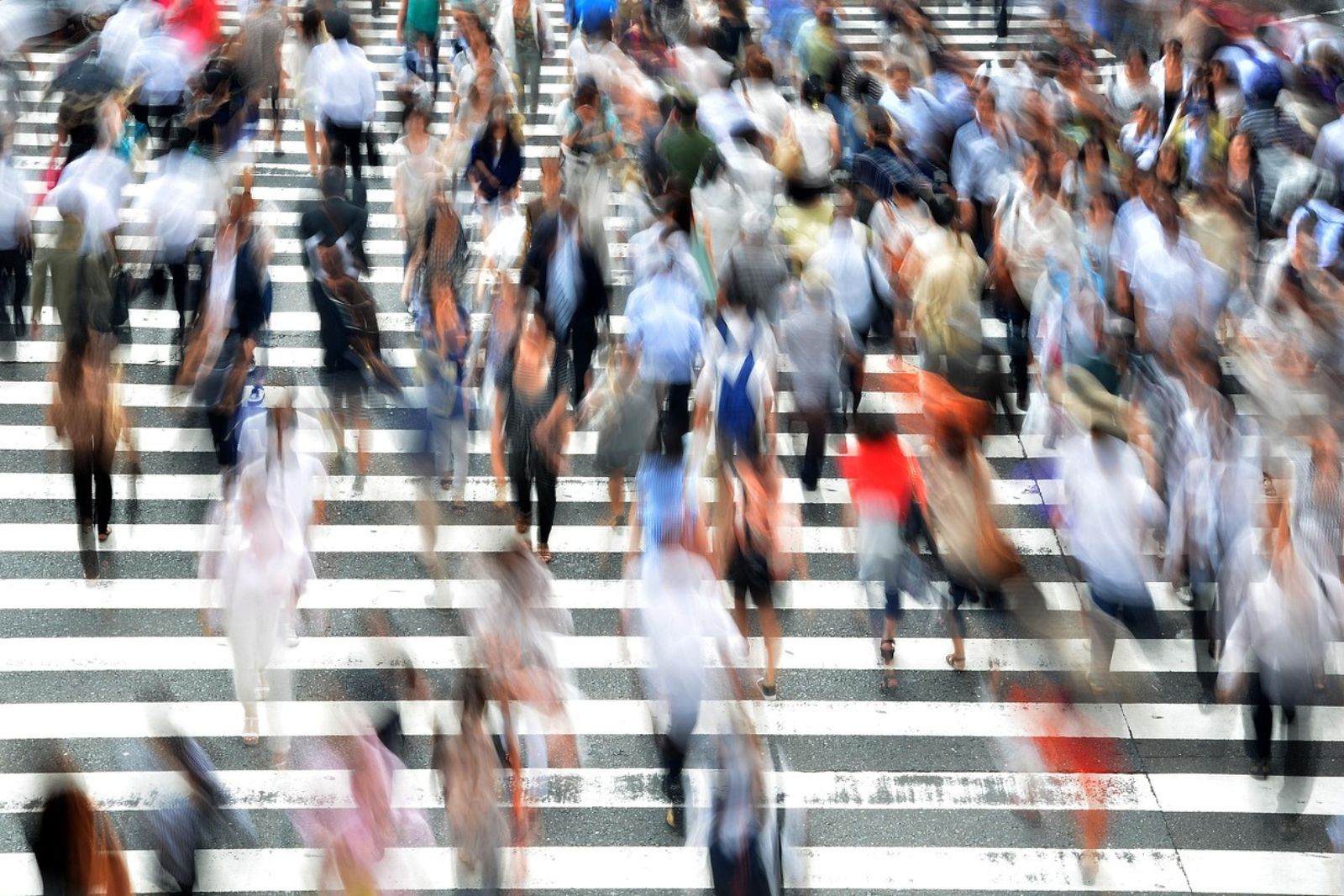 People moving through a busy city